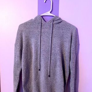Grey sweater with hood.